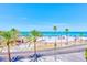 Scenic view of the pristine beach with turquoise waters and swaying palm trees at 301 S Gulfview Blvd # 301, Clearwater Beach, FL 33767