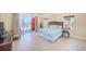 Bright bedroom with balcony access, featuring a coastal view and comfortable bed at 301 S Gulfview Blvd # 301, Clearwater Beach, FL 33767