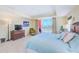 Bedroom with ocean view and a relaxing ambiance, featuring a cozy chair and ample natural light at 301 S Gulfview Blvd # 301, Clearwater Beach, FL 33767