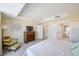 Bright bedroom with tile floors, dresser, and ensuite bath at 301 S Gulfview Blvd # 301, Clearwater Beach, FL 33767