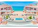Charming courtyard featuring a hot tub, lounge chairs, and lush landscaping with ocean view at 301 S Gulfview Blvd # 301, Clearwater Beach, FL 33767