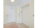 Hallway of condo with elevator and door to condo at 301 S Gulfview Blvd # 301, Clearwater Beach, FL 33767