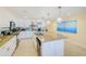Modern kitchen with a large island, granite countertops, and stainless steel appliances at 301 S Gulfview Blvd # 301, Clearwater Beach, FL 33767
