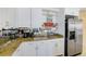 Charming kitchen with plenty of counter space and a refrigerator at 301 S Gulfview Blvd # 301, Clearwater Beach, FL 33767