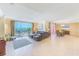Bright living room with tile floors, comfortable seating, and amazing ocean views at 301 S Gulfview Blvd # 301, Clearwater Beach, FL 33767