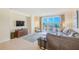 Comfortable living room with TV and ocean view balcony at 301 S Gulfview Blvd # 301, Clearwater Beach, FL 33767