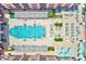 Aerial view of the pool and lounge area with neatly organized seating and landscaping at 301 S Gulfview Blvd # 301, Clearwater Beach, FL 33767