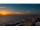 Beautiful sunset view over the ocean, beach and resort buildings, highlighting a relaxing coastal lifestyle at 301 S Gulfview Blvd # 301, Clearwater Beach, FL 33767