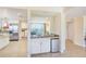 Open concept wet bar area with beverage refrigerator at 301 S Gulfview Blvd # 301, Clearwater Beach, FL 33767