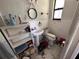 Bathroom features a sink, toilet, and open shelving. Needs TLC at 314 Dickman Sw Dr, Ruskin, FL 33570