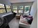 Bright bedroom features multiple windows, a tile floor, and ample natural light at 314 Dickman Sw Dr, Ruskin, FL 33570