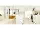 Bright kitchen with an island, stainless appliances, and white cabinetry, offering ample counter space at 31814 Griffin Sands Ln, San Antonio, FL 33576