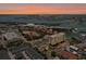 Aerial view of the waterfront community, showing ocean, waterways, and city views at 320 Island Way # 205, Clearwater Beach, FL 33767