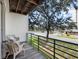Relaxing balcony offers neighborhood views and comfortable seating, perfect for enjoying the outdoors at 320 Island Way # 205, Clearwater Beach, FL 33767