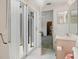 The bathroom has a glass sliding door to the outside and a vanity sink at 320 Island Way # 205, Clearwater Beach, FL 33767