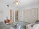 Bedroom with view into the hallway and dual closets at 320 Island Way # 205, Clearwater Beach, FL 33767
