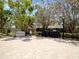Community grilling area features stone flooring, grill, seating and manicured landscaping at 320 Island Way # 205, Clearwater Beach, FL 33767