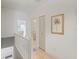 Upstairs hallway with closet and palm tree art at 320 Island Way # 205, Clearwater Beach, FL 33767