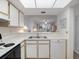 Bright kitchen overlooking the living area, ideal for entertaining guests at 320 Island Way # 205, Clearwater Beach, FL 33767