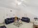 Open living room with vaulted ceilings, sofas, carpet, and fan at 320 Island Way # 205, Clearwater Beach, FL 33767