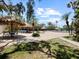 Poolside patio area complete with thatched umbrellas, lounge chairs, and inviting pool view at 320 Island Way # 205, Clearwater Beach, FL 33767