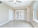 Bright bedroom with tile flooring, double doors, and a ceiling fan at 345 Bayshore Blvd # 1813, Tampa, FL 33606