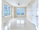 Bright bedroom with tile flooring, windows, and a ceiling fan at 345 Bayshore Blvd # 1813, Tampa, FL 33606