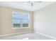 Bright bedroom with a large window offering city views, and stylish ceiling fan at 345 Bayshore Blvd # 1813, Tampa, FL 33606