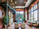 Cozy library room featuring spiral staircase, fireplace, and large windows at 345 Bayshore Blvd # 1813, Tampa, FL 33606