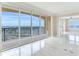 Open living space with balcony access, marble floors, and scenic views at 345 Bayshore Blvd # 1813, Tampa, FL 33606