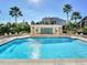 Community pool features a tile water feature and mature tropical landscaping at 345 Bayshore Blvd # 1813, Tampa, FL 33606