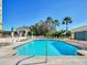 Beautiful community pool surrounded by lush tropical landscaping on a sunny day at 345 Bayshore Blvd # 1813, Tampa, FL 33606