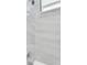 Updated bathroom with modern shower featuring rain shower head and marble-look tiling at 3616 W Anderson Ave, Tampa, FL 33611