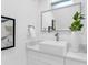 Bright bathroom vanity with elegant vessel sink, modern fixtures and marble countertop at 3616 W Anderson Ave, Tampa, FL 33611