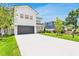 Two-story home with attached garage, well-maintained lawn and long driveway at 3616 W Anderson Ave, Tampa, FL 33611