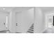 Bright hallway with white walls, modern doors, and staircase, offering a clean and minimalist design at 3616 W Anderson Ave, Tampa, FL 33611
