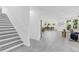 Inviting hallway showcases an open floor plan with staircase and dining area views at 3616 W Anderson Ave, Tampa, FL 33611
