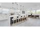 Bright kitchen with island seating, pendant lights, and views of the dining area at 3616 W Anderson Ave, Tampa, FL 33611
