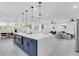 This open kitchen has a large island with an eat-in bar, and is next to the living area at 3616 W Anderson Ave, Tampa, FL 33611