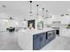 Open concept kitchen features a large island and connects to the living area at 3616 W Anderson Ave, Tampa, FL 33611