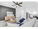 Inviting living room with stylish decor, featuring a comfortable couch and open-concept to the kitchen at 3616 W Anderson Ave, Tampa, FL 33611