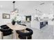 Open-concept living room, dining room and kitchen with contemporary design and ample space at 3616 W Anderson Ave, Tampa, FL 33611