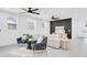 Bright living room with hardwood floors, modern furniture, and ample natural light at 3616 W Anderson Ave, Tampa, FL 33611