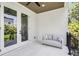Outdoor patio features a comfortable seating area and stylish ceiling fan at 3616 W Anderson Ave, Tampa, FL 33611