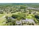 Aerial view of Lansbrook Golf Course with lush trees and fairways at 4320 Auston Way, Palm Harbor, FL 34685