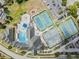 Overhead view of Lansbrook community pool, tennis courts, playground, and parking at 4320 Auston Way, Palm Harbor, FL 34685
