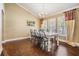 Dining room featuring hardwood floors, a chandelier, and bright natural light at 4320 Auston Way, Palm Harbor, FL 34685