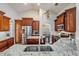 Gourmet kitchen with granite countertops, stainless steel appliances, and custom cabinetry at 4320 Auston Way, Palm Harbor, FL 34685