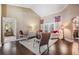 Inviting living room featuring hardwood floors, neutral colors, and access to the exterior at 4320 Auston Way, Palm Harbor, FL 34685