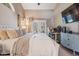 Comfortable main bedroom featuring neutral colors, a king-size bed, and access to the outdoor space at 4320 Auston Way, Palm Harbor, FL 34685
